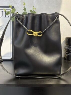 Black Leather Drawstring Crossbody with Gold Knot Accent